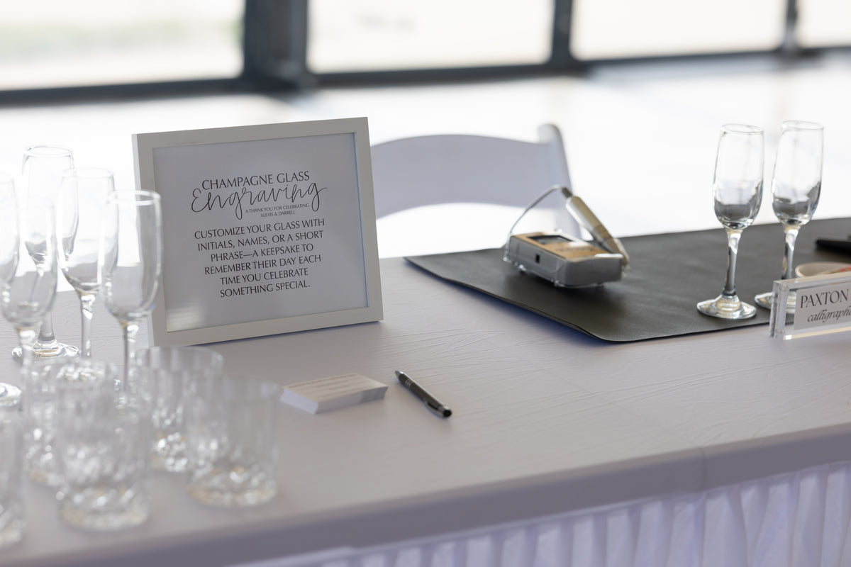 Live calligraphy and engraving station at a Kansas City wedding cocktail hour
