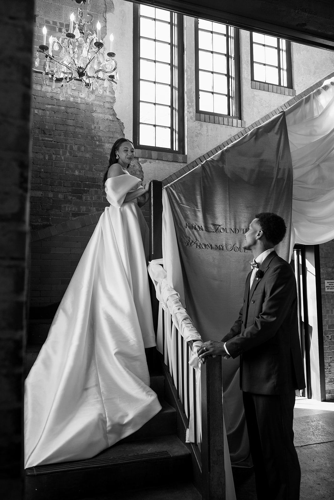 15-foot silk pink banner draped down the staircase at The Firehouse KC — I have found the one whom my soul loves