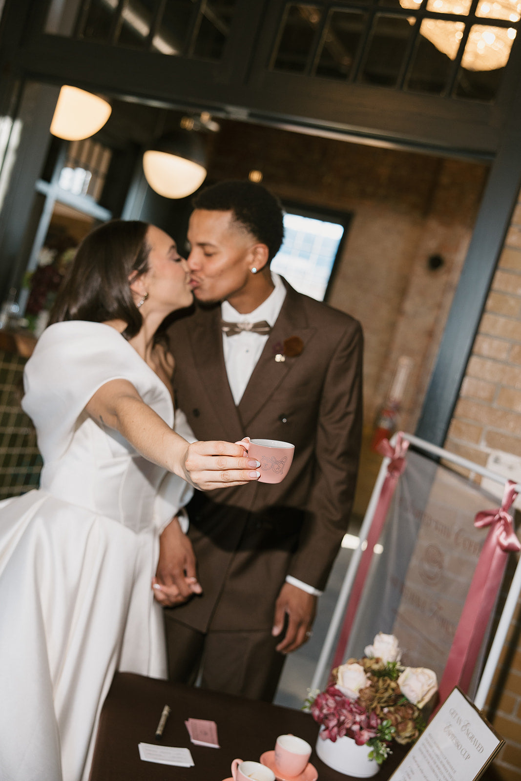 Live engraving station with custom sheer fabric sign at The Firehouse KC Kansas City wedding